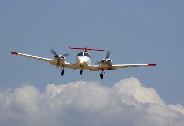 A Piper PA-44 Seminole in flight — the school’s multi-engine type