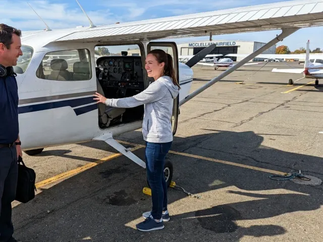 A first-time flyer at the aircraft before a lesson